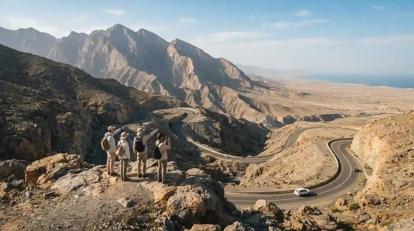 Travelers viewing the rugged mountains and scenic landscape of Ras Al Khaimah