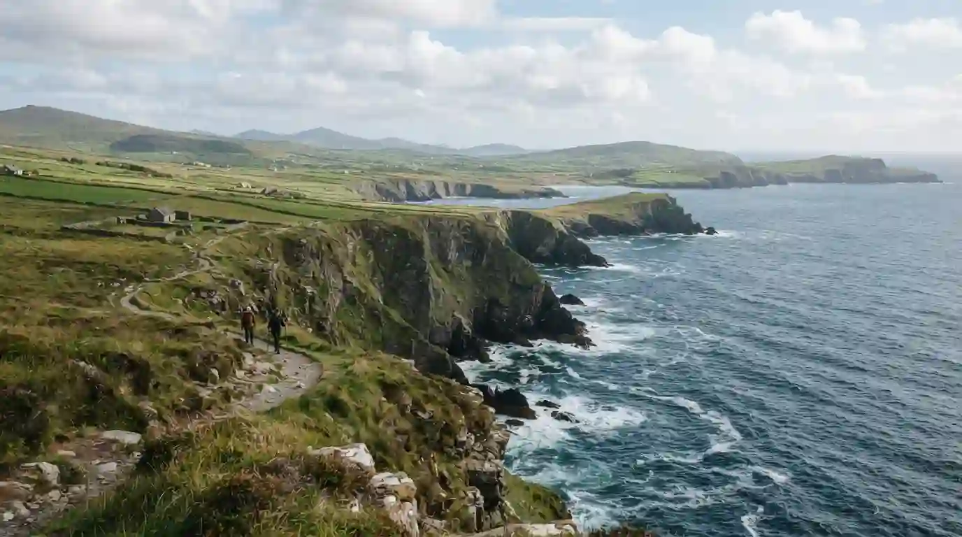 Dramatic green Irish cliffs overlooking the Atlantic Ocean with a scenic walking path